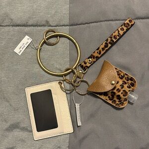 Cream/brown cheetah print key chain.